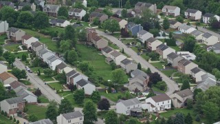 4.8K aerial stock footage passing a suburban neighborhood, Penn Hills, Pennsylvania Aerial Stock Footage | AX105_094E