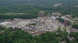 AX105_097 - 4.8K aerial stock footage of a strip mall and post office, Penn Hills, Pennsylvania