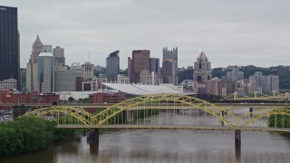 4.8K aerial stock footage fly over bridge to approach Convention Center in Downtown Pittsburgh, Pennsylvania Aerial Stock Footage | AX105_150E