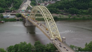 AX105_158 - 4.8K aerial stock footage orbiting Fort Pitt Bridge, Downtown Pittsburgh, Pennsylvania