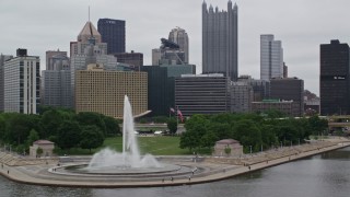 4.8K aerial stock footage flying by fountain at Point State Park and Downtown Pittsburgh, Pennsylvania Aerial Stock Footage | AX105_162E