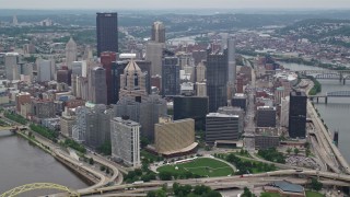 AX105_196E - 4.8K aerial stock footage approaching and flying over Downtown Pittsburgh, Pennsylvania