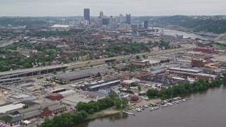 4.8K aerial stock footage approaching warehouses near Downtown Pittsburgh, Pennsylvania Aerial Stock Footage | AX105_223E