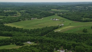 4.8K aerial stock footage of farmland in Beaver Falls, Pennsylvania Aerial Stock Footage | AX106_041E