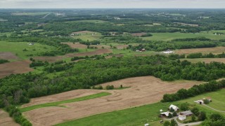 4.8K aerial stock footage of farms and trees in Enon Valley, Pennsylvania Aerial Stock Footage | AX106_059