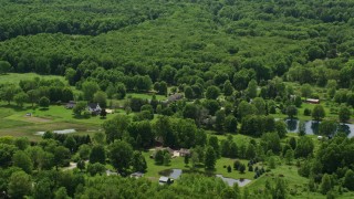 4.8K aerial stock footage of farms and pond in Windham, Ohio Aerial Stock Footage | AX106_141