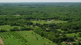 4.8K aerial stock footage flying over rural homes and forest in Hiram, Ohio Aerial Stock Footage | AX106_150E