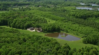 4.8K aerial stock footage of a waterfront home, reservoir and forest in Chagrin Falls, Ohio Aerial Stock Footage | AX106_152E