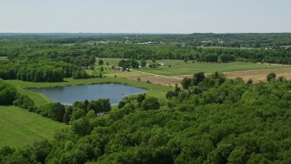 4.8K aerial stock footage of a pond by Farm in Chagrin Falls, Ohio Aerial Stock Footage | AX106_163E