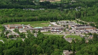 AX106_173E - 4.8K aerial stock footage of a strip mall in Chagrin Falls, Ohio