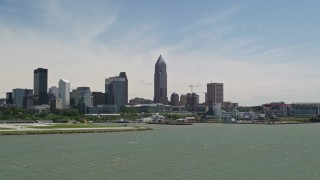 AX106_205E - 4.8K aerial stock footage of the skyline and waterfront stadium in Downtown Cleveland, Ohio