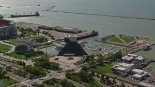 AX107_011 - 4.8K aerial stock footage flying over Rock and Roll Hall of Fame and Great Lakes Science Center, Cleveland Ohio