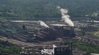 4.8K aerial stock footage of a factory with smoke stacks, Cleveland, Ohio Aerial Stock Footage | AX107_048