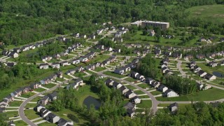 AX107_063 - 4.8K aerial stock footage of an upscale home neighborhood, Cleveland, Ohio