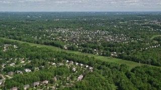 4.8K aerial stock footage of a suburban neighborhood among trees, Solon, Ohio Aerial Stock Footage | AX107_064