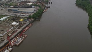 4.8K aerial stock footage of warehouse buildings along the river, Neville Island, Pittsburgh Aerial Stock Footage | AX107_159