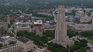 AX107_182 - 4.8K aerial stock footage of Cathedral of Learning and Heinz Memorial Chapel, University of Pittsburgh, Pennsylvania