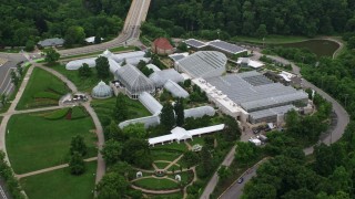 AX107_185E - 4.8K aerial stock footage of Phipps Conservatory & Botanical Gardens, Pittsburgh, Pennsylvania