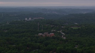 4K aerial stock footage of apartment buildings surrounded by trees, Pittsburgh, Pennsylvania Aerial Stock Footage | AX108_004