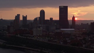 4K aerial stock footage of Downtown Pittsburgh skyline from the Monongahela River, Pennsylvania, sunset Aerial Stock Footage | AX108_055E