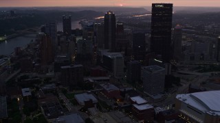 4K aerial stock footage flyby downtown skyscrapers, then approach BNY Mellon Center, Downtown Pittsburgh, twilight Aerial Stock Footage | AX108_080E