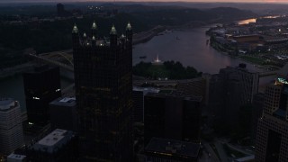 4K aerial stock footage approaching PPG Place revealing Point State Park, Downtown Pittsburgh, Pennsylvania, twilight Aerial Stock Footage | AX108_084E