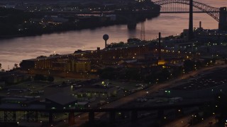 4K aerial stock footage of Western State Penitentiary along the river, Pittsburgh, Pennsylvania, twilight Aerial Stock Footage | AX108_155