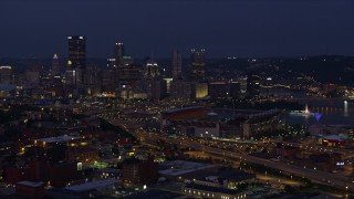 4K aerial stock footage approaching Downtown Pittsburgh and Heinz Field, Pennsylvania, night Aerial Stock Footage | AX108_157E