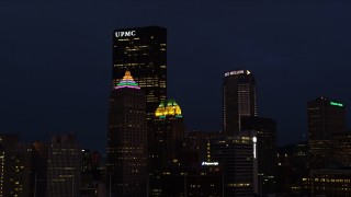 4K aerial stock footage of Gulf Tower and U.S. Steel Tower, Pittsburgh, Pennsylvania, night Aerial Stock Footage | AX108_173