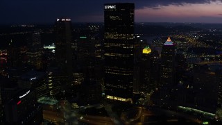 4K aerial stock footage of Gulf Tower and U.S. Steel Tower, Pittsburgh, Pennsylvania, twilight Aerial Stock Footage | AX108_177E