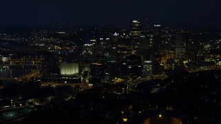 4K aerial stock footage of skyscrapers seen from Monongahela River, Downtown Pittsburgh, Pennsylvania, night Aerial Stock Footage | AX108_202E