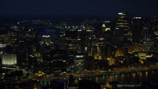 4K aerial stock footage of Downtown Pittsburgh city buildings and skyscrapers, Pennsylvania, night Aerial Stock Footage | AX108_204E