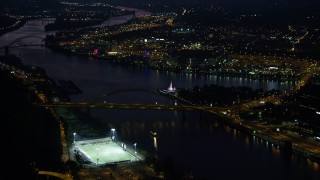 4K aerial stock footage approaching Point State Park, Downtown Pittsburgh, night Aerial Stock Footage | AX108_209