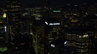 4K aerial stock footage flying by skyscrapers, Downtown Pittsburgh, Pennsylvania, night Aerial Stock Footage | AX108_222E