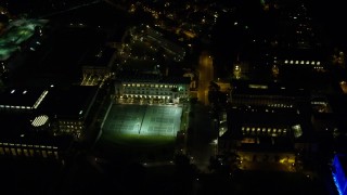 4K aerial stock footage tilting down on the Carnegie Mellon University campus, Pittsburgh, Pennsylvania, night Aerial Stock Footage | AX108_246E