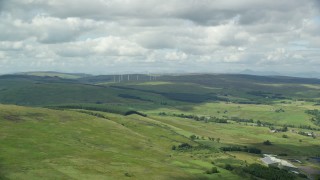 AX109_005 - 5.5K aerial stock footage of windmills and farms, Denny, Scotland