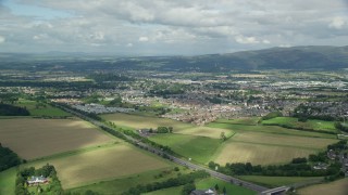 5.5K aerial stock footage video of flying over farms toward rural homes, Stirling, Scotland Aerial Stock Footage | AX109_013