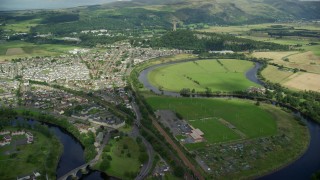 AX109_044E - 5.5K aerial stock footage of approaching Wallace Monument surrounded by trees, Stirling, Scotland