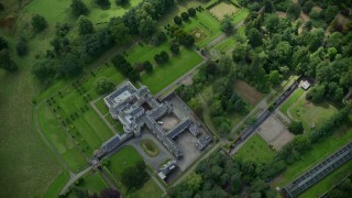 5.5K aerial stock footage of Keir House surrounded by trees, Scotland Aerial Stock Footage | AX109_060