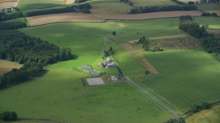 5.5K aerial stock footage of flying over a sheep farm, Stirling, Scotland Aerial Stock Footage | AX109_061E