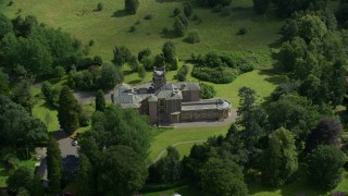 AX109_081E - 5.5K aerial stock footage orbit Manor Hall Center for Trauma hospital and neighboring homes, Scotland