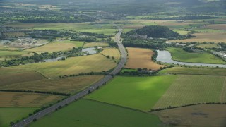 5.5K aerial stock footage of M9 highway and farmland in Stirling, Scotland Aerial Stock Footage | AX109_095E