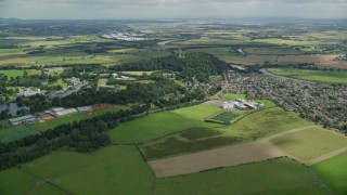 AX109_097E - 5.5K aerial stock footage of approaching Wallace Monument surrounded by trees, Stirling, Scotland