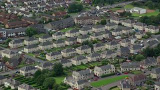 5.5K aerial stock footage of town houses in a Scottish neighborhood, Falkirk, Scotland Aerial Stock Footage | AX109_134E