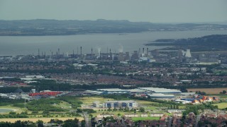 5.5K aerial stock footage of a natural gas power plant along the water, Falkirk, Scotland Aerial Stock Footage | AX109_149