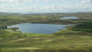 AX110_018E - 5.5K aerial stock footage fly over Earlsburn Reservoir 2 and approach Gargunnock Hills, Scotland