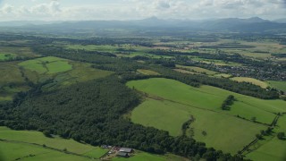 5.5K aerial stock footage of forests and farm fields, Kippen, Scotland Aerial Stock Footage | AX110_029E