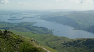 AX110_051 - 5.5K aerial stock footage of Loch Lomond seen from Ben Lomond, Scottish Highlands, Scotland