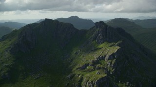 5.5K aerial stock footage of orbiting green mountain peak, The Cobbler, Scottish Highlands, Scotland Aerial Stock Footage | AX110_074E