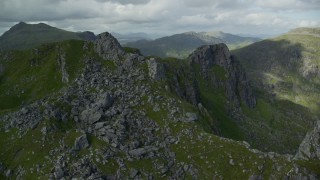 5.5K aerial stock footage of orbiting a jagged summit of The Cobbler, Scottish Highlands, Scotland Aerial Stock Footage | AX110_081E